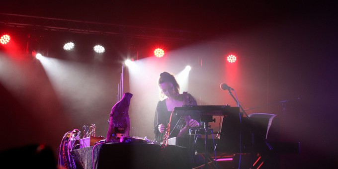 Gwen Sion AKA catHead performing live with her electronic instruments at Ara Deg festival 2023