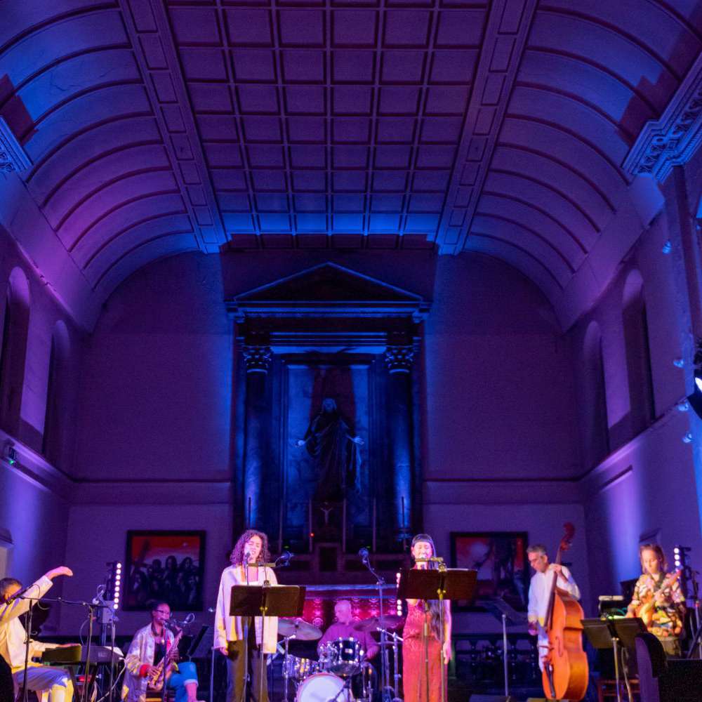 An image showing Arun Ghosh's The Canticle of the Sun on stage at Spitalfields Music Festival, St John on Bethnal Green. Photo by James Berry.